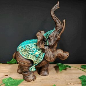 ELEFANTE PATA LEVANTADA TURQUESA 28CM
